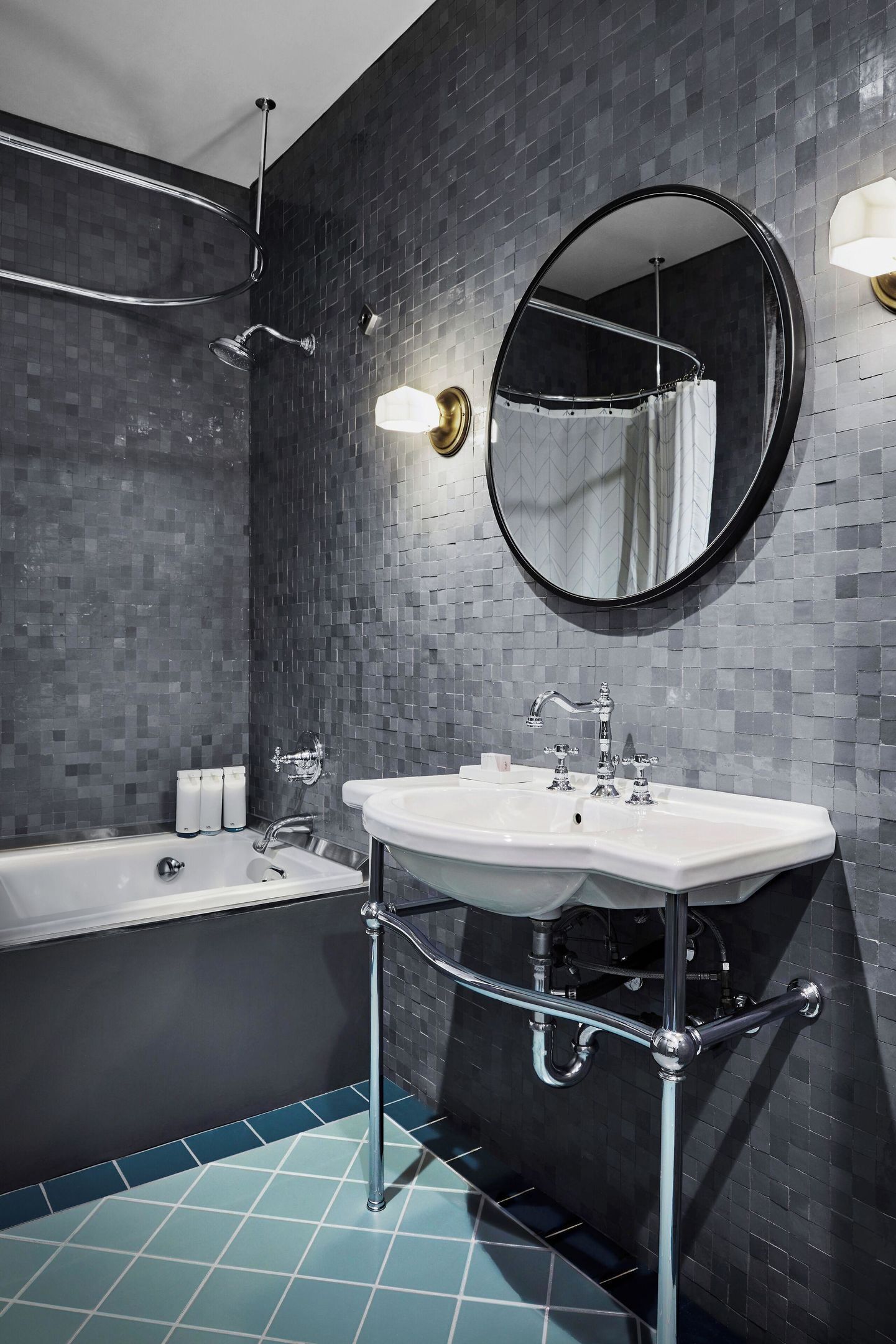 A modern bathroom with a bathtub, a sink, and a mirror.