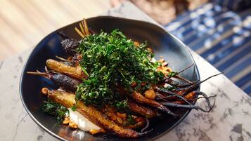 A plate of food with vegetables and herbs.