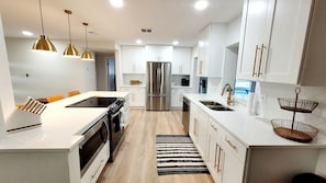 Fridge, microwave, oven, stovetop - Spacious Family Retreat w/ Heated Saltwater Pool, Games, & Near Clearwater Beach (Clearwater)