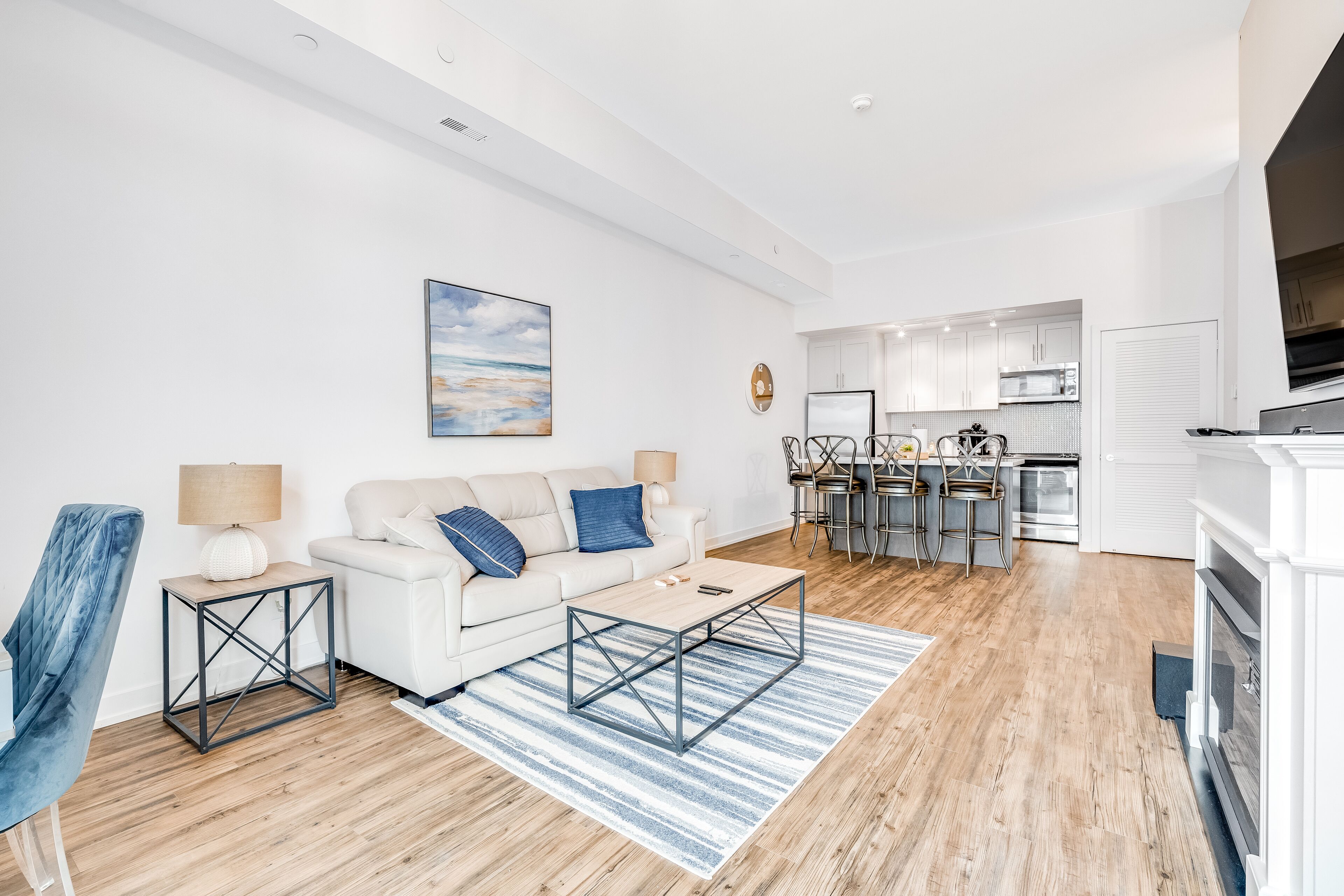 Stylish waterfront retreat with patio, AC, pools, fitness room, & dock