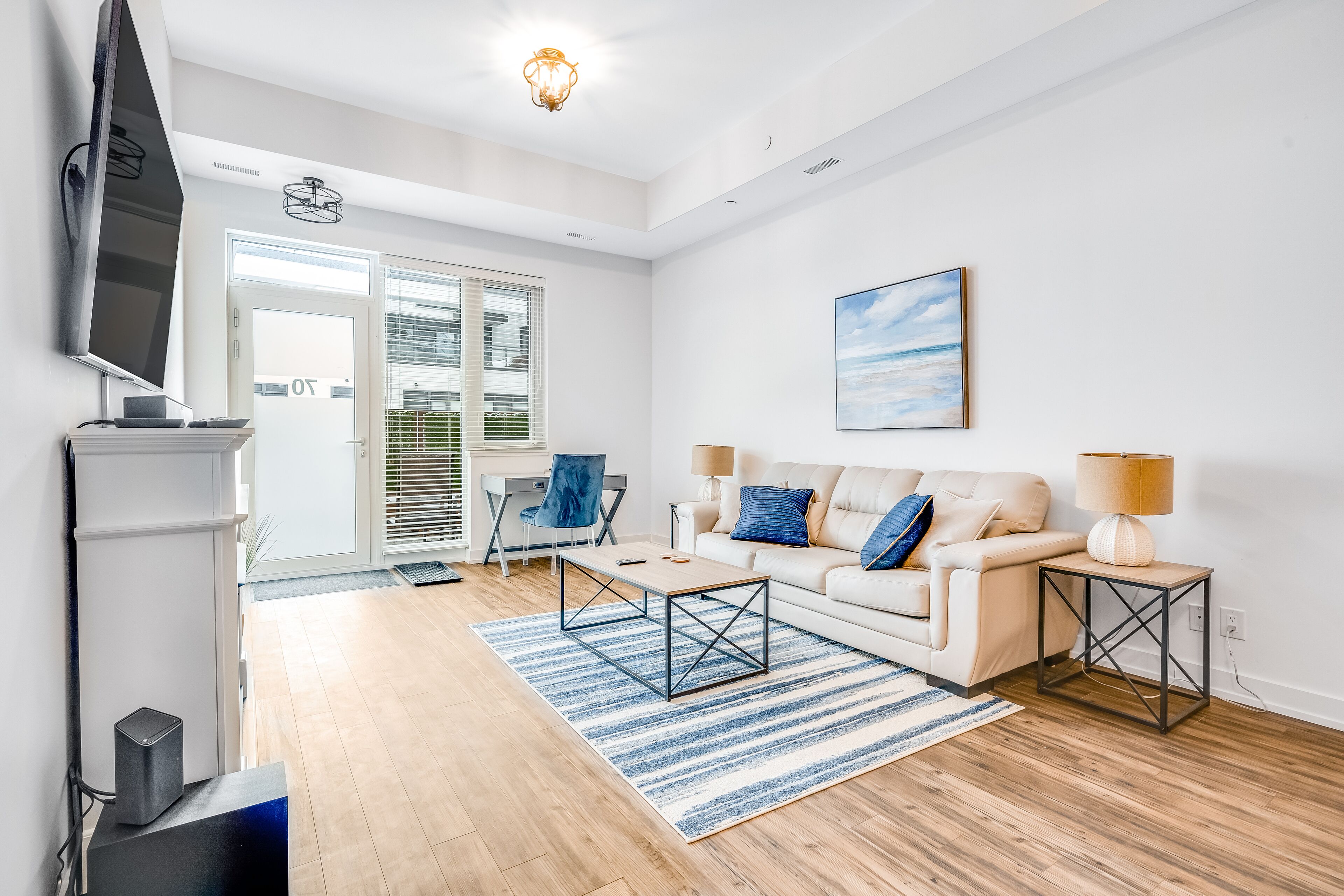 Stylish waterfront retreat with patio, AC, pools, fitness room, & dock