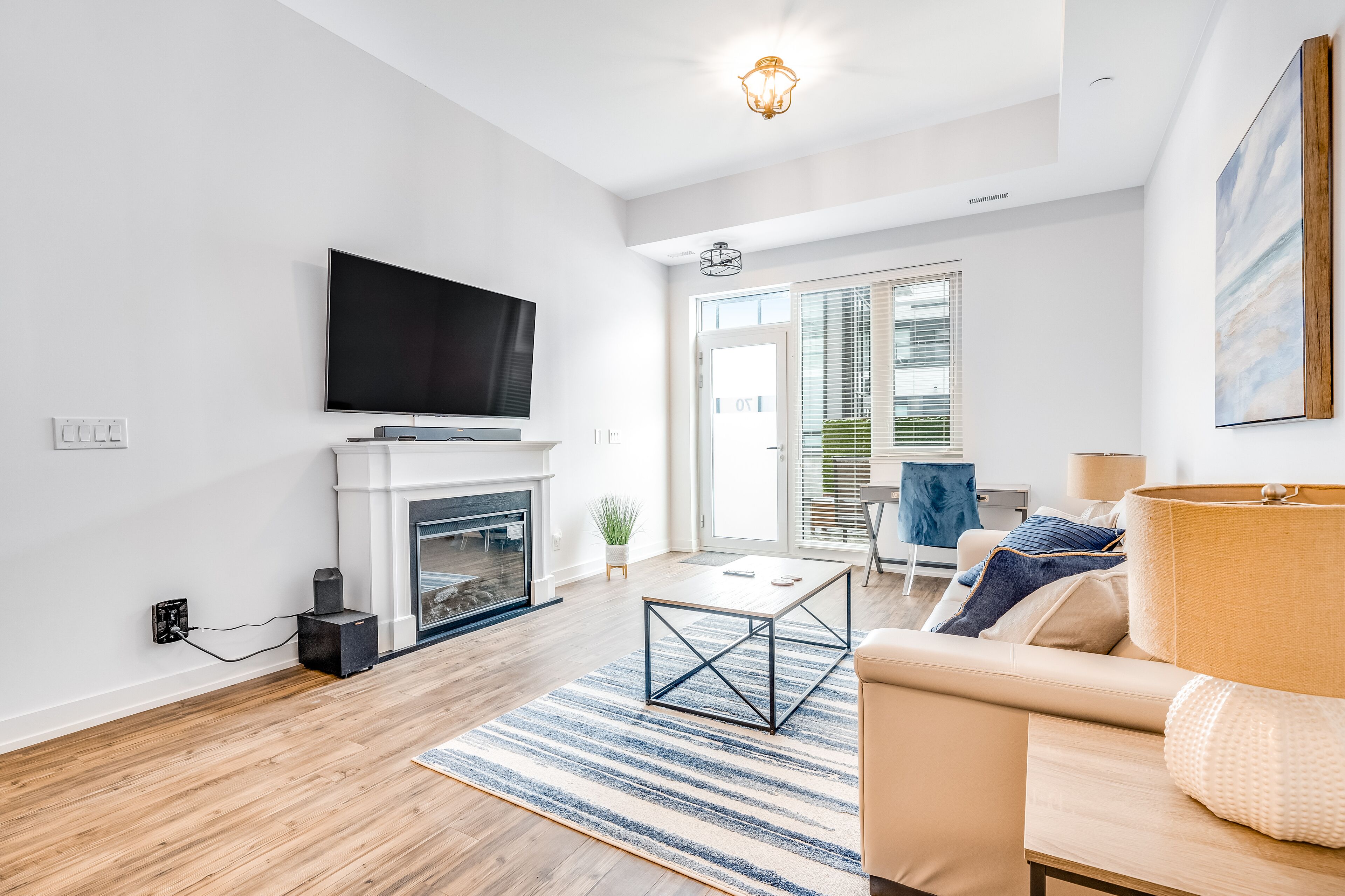 Stylish waterfront retreat with patio, AC, pools, fitness room, & dock