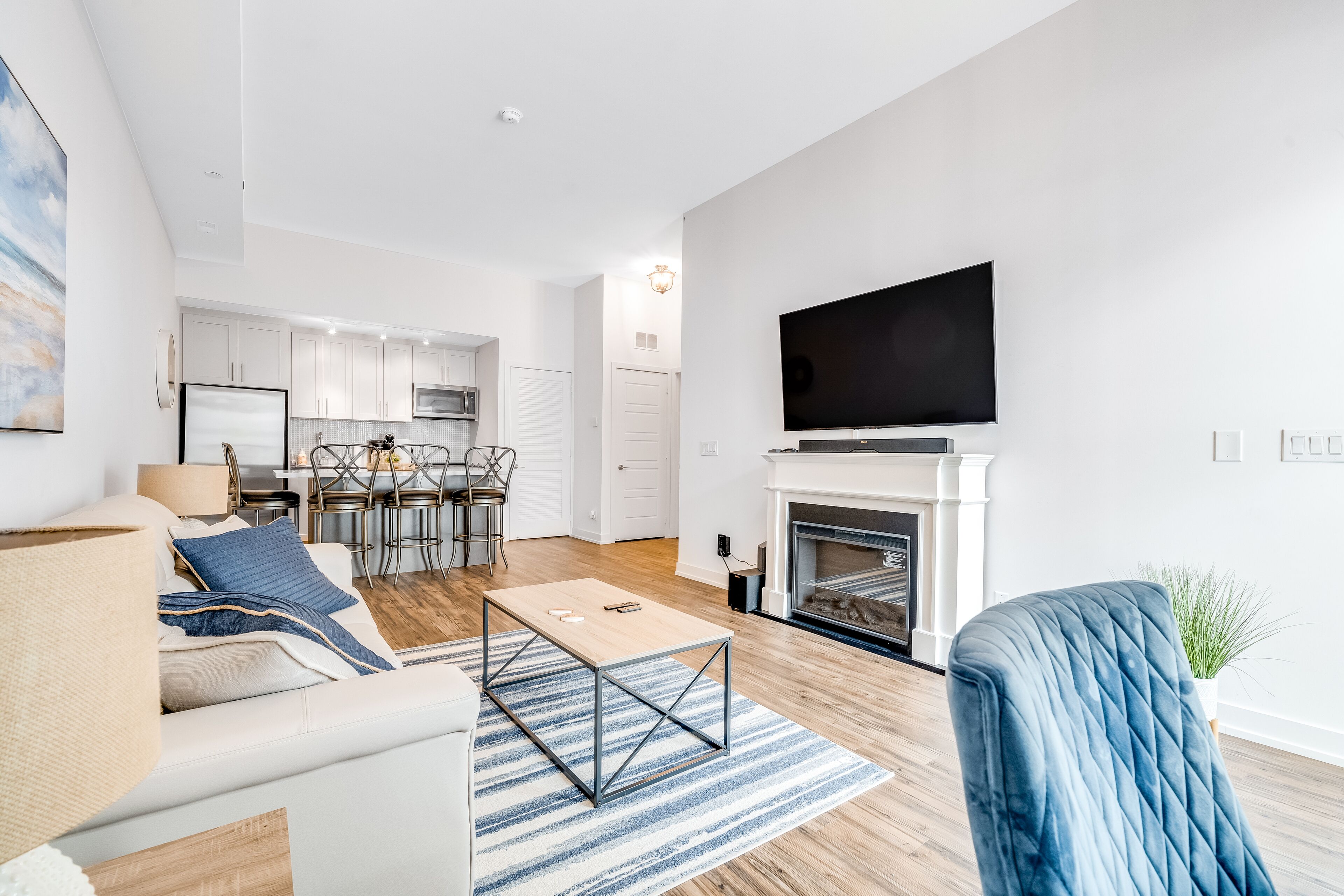 Stylish waterfront retreat with patio, AC, pools, fitness room, & dock