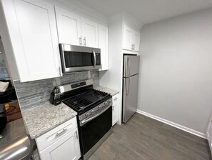 Fridge, microwave, dishwasher, coffee/tea maker