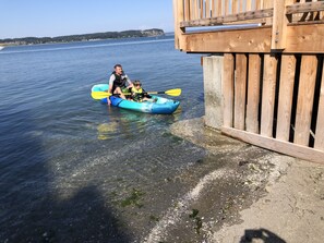 A wooden dock extending into a calm body of water.