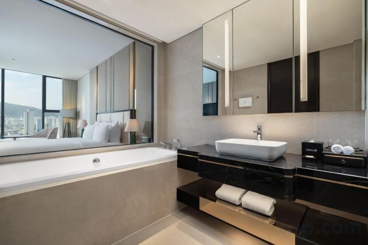 Bathroom | Rainfall showerhead, designer toiletries, hair dryer, towels
