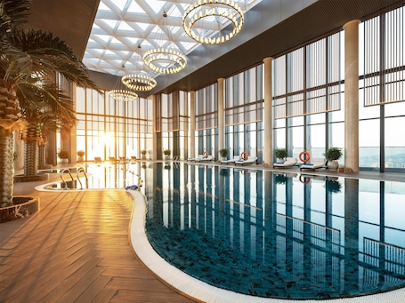 Indoor pool, outdoor pool, pool umbrellas, sun loungers