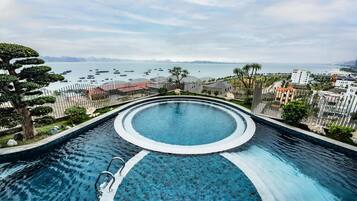 Indoor pool, outdoor pool, pool umbrellas, pool loungers