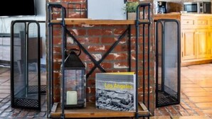 A brick wall with a 'Welcome' sign, a small table with a candle, and a vintage Los Angeles poster. - 5Bed/POOL - Near Hollywood/Burbank/Universal/Beach (Los Angeles)