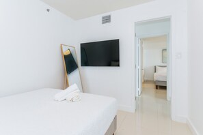 1 bedroom, desk, iron/ironing board, travel crib