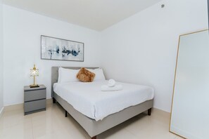 1 bedroom, desk, iron/ironing board, travel crib