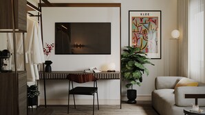 A modern living room with a flat-screen TV, a sofa, a coffee table, a plant, and a wooden floor. - The Parrs Bank Hotel  (Warrington)