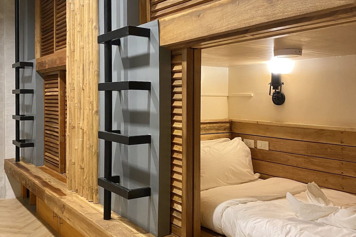 Premium bedding, individually furnished, laptop workspace