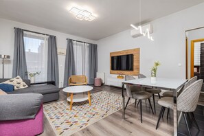 Apartment | Living area | 38-inch Smart TV with cable channels, TV - Venus Apartments - King Street V (Budapest)