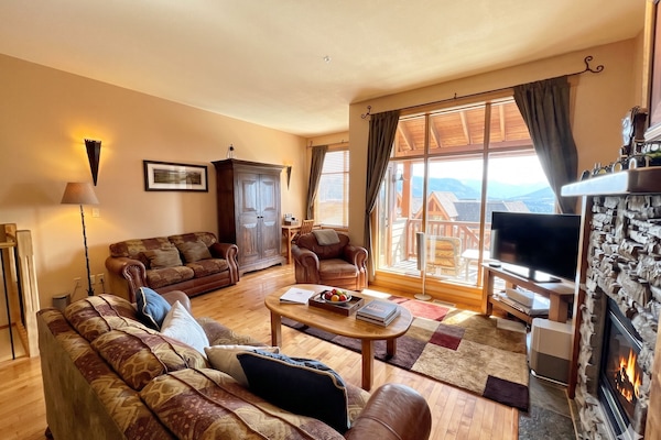 Time to kick back and relax in this spacious, cozy living area. The door leads out to the front BBQ deck. Cable TV and Natural Gas Fireplace.