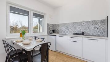 Fridge, stovetop, electric kettle, toaster