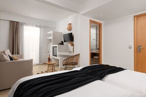 A modern hotel room with a bed, a sofa, a desk, and a chair. - Diana Art Boutique Hotel  (Rhodes)