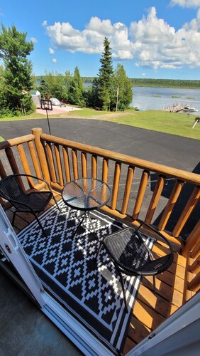 Modern Costa Del Sol Flat Overlooking Pokemouche River, with swimming off dock.
