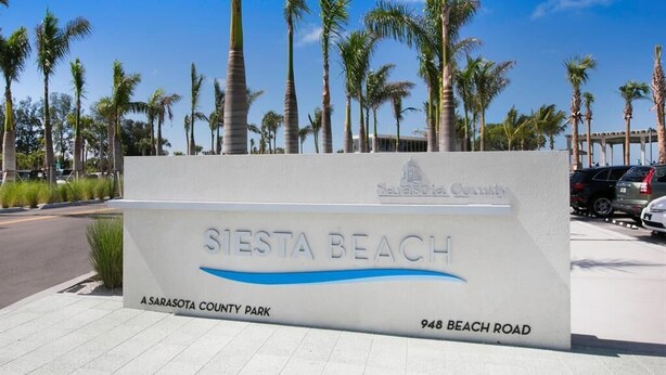A sign for Siesta Beach, a Sarasota County Park, located at 948 Beach Road. - Siesta Key Escape: Spacious 2BR /2BA Near Beach + Dining (Siesta Key)