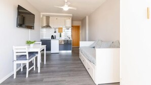 A modern apartment with a kitchen, dining area, and living room. - Apartment Miami by Interhome (Empuriabrava)
