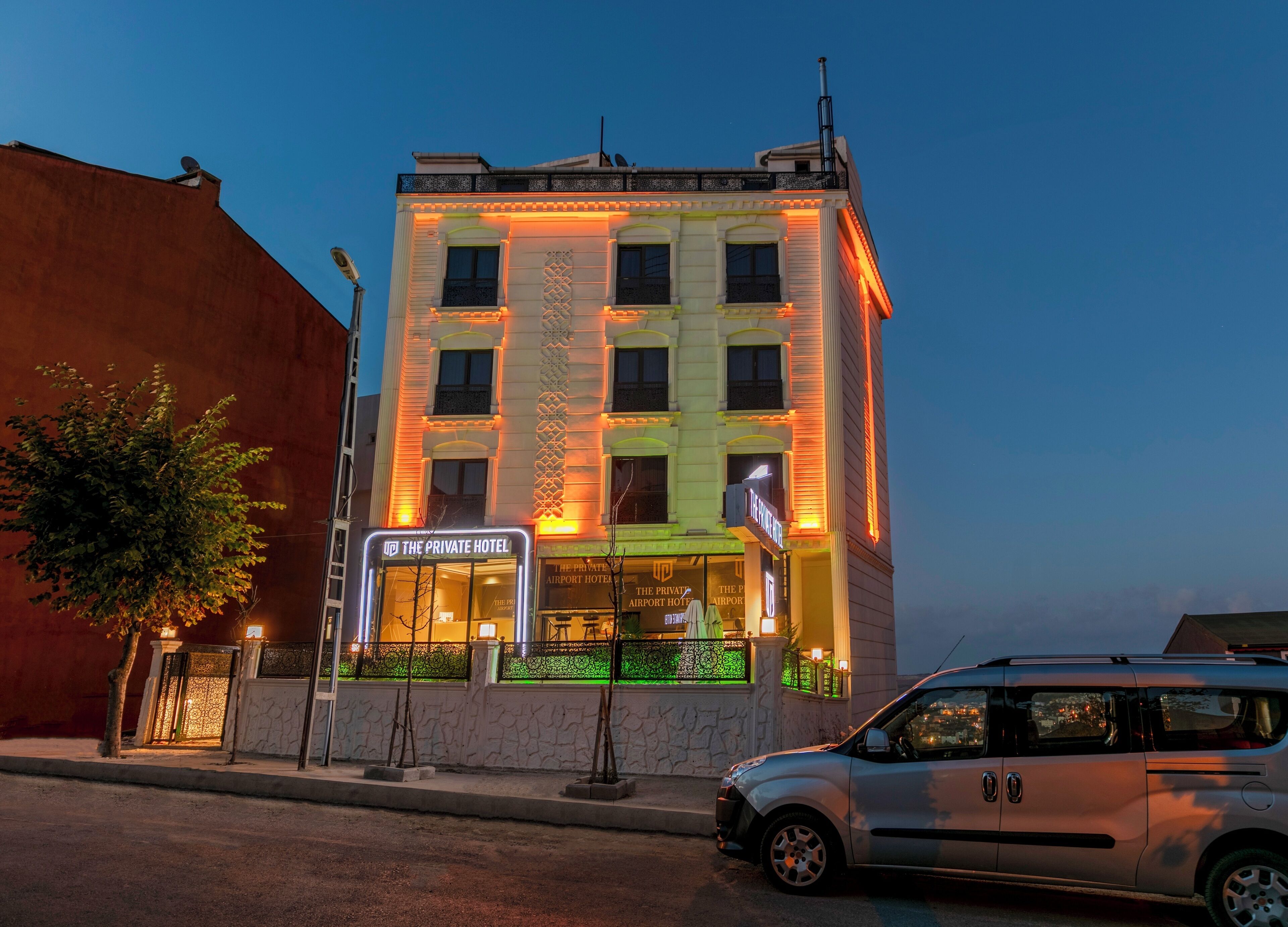 A hotel with a sign reading "The Private Hotel" and a visible entrance.