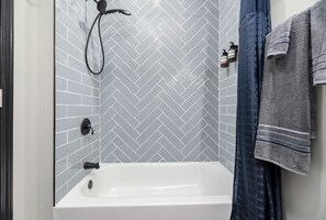 Bathtub, hair dryer, towels, soap