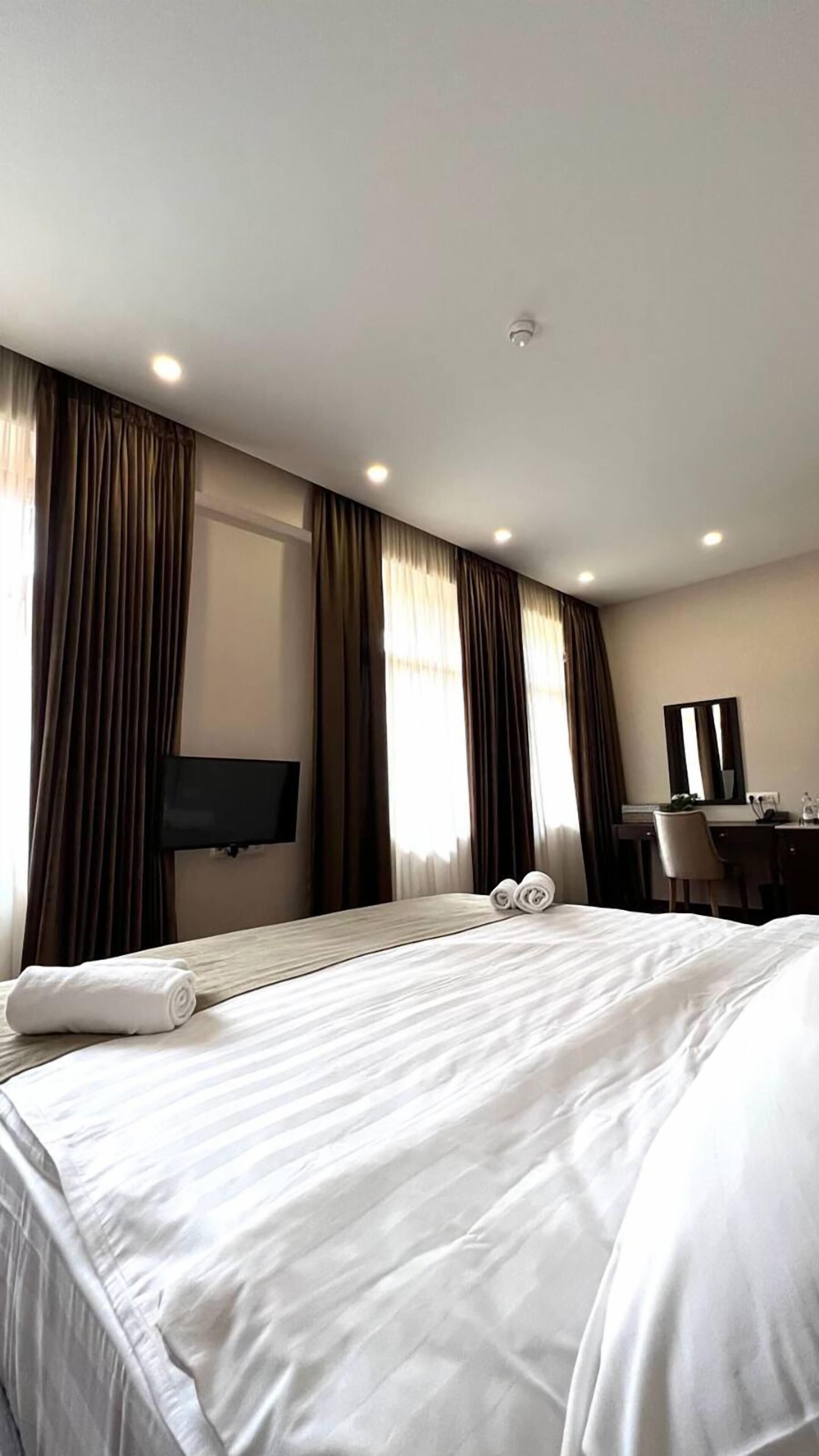Premium bedding, down comforters, desk, laptop workspace