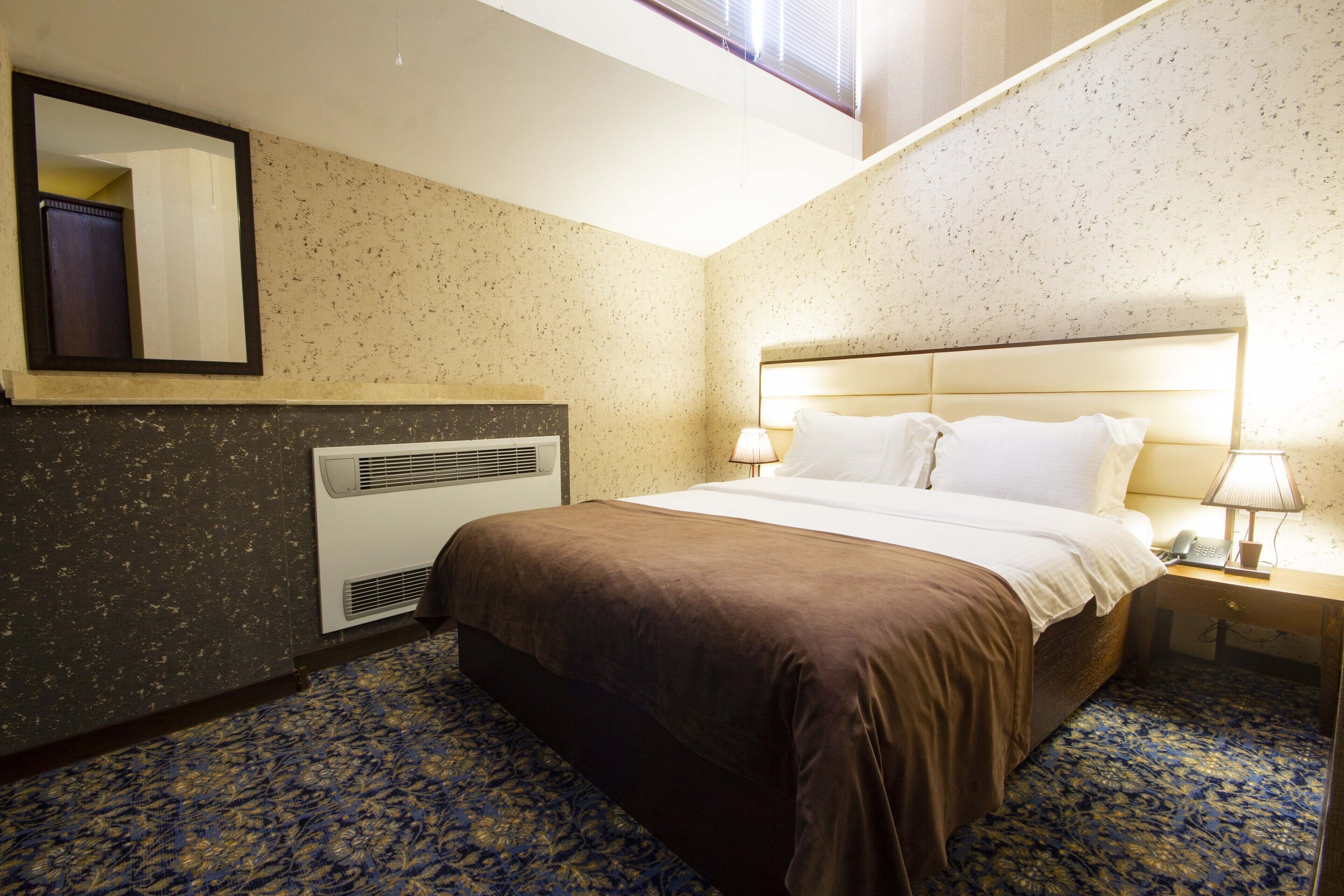 Premium bedding, down comforters, desk, laptop workspace