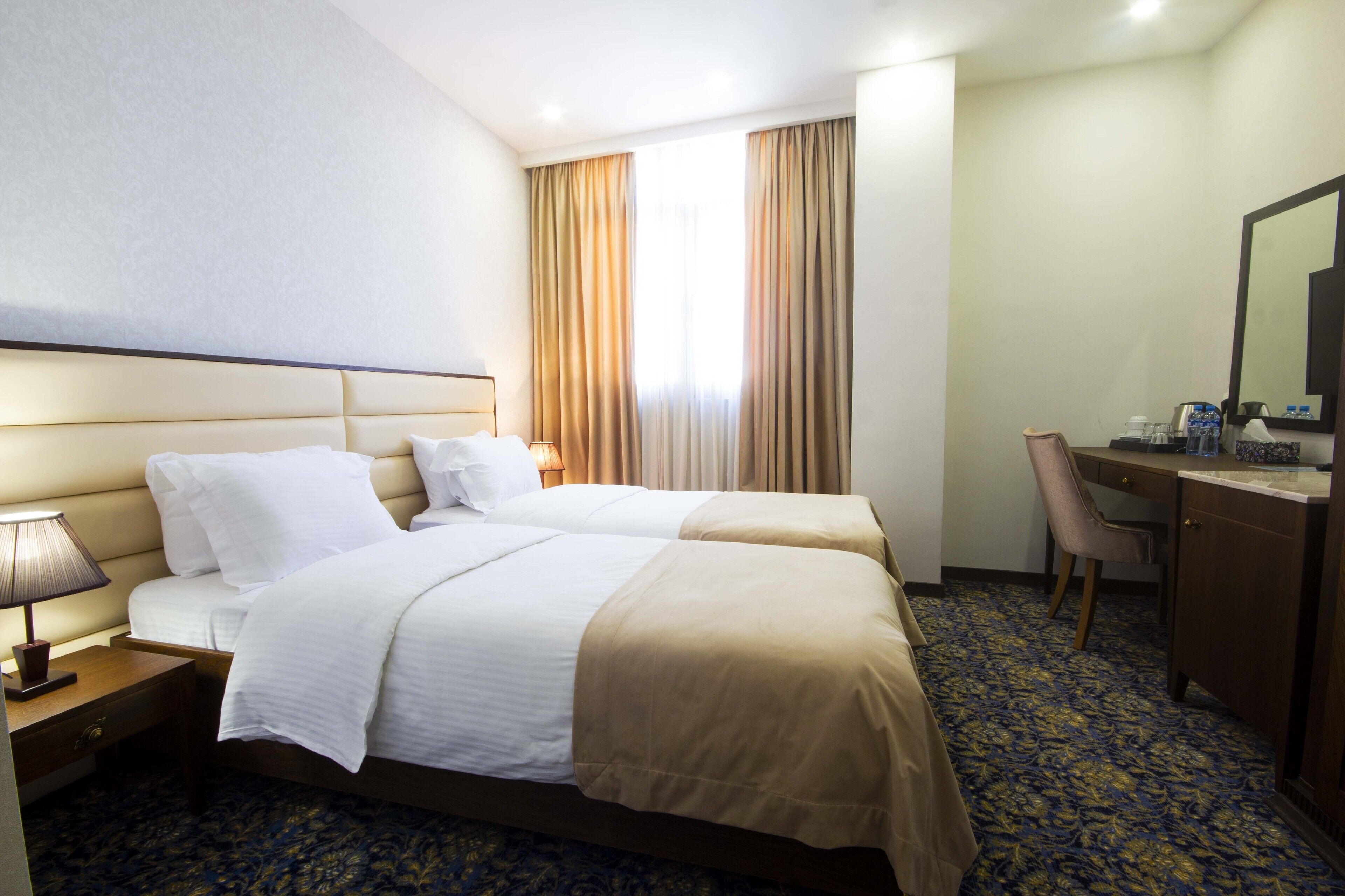 Premium bedding, down comforters, desk, laptop workspace