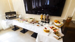 A buffet table with various food items and a coffee station. - Sota Metekhi Hotel (Tbilisi)