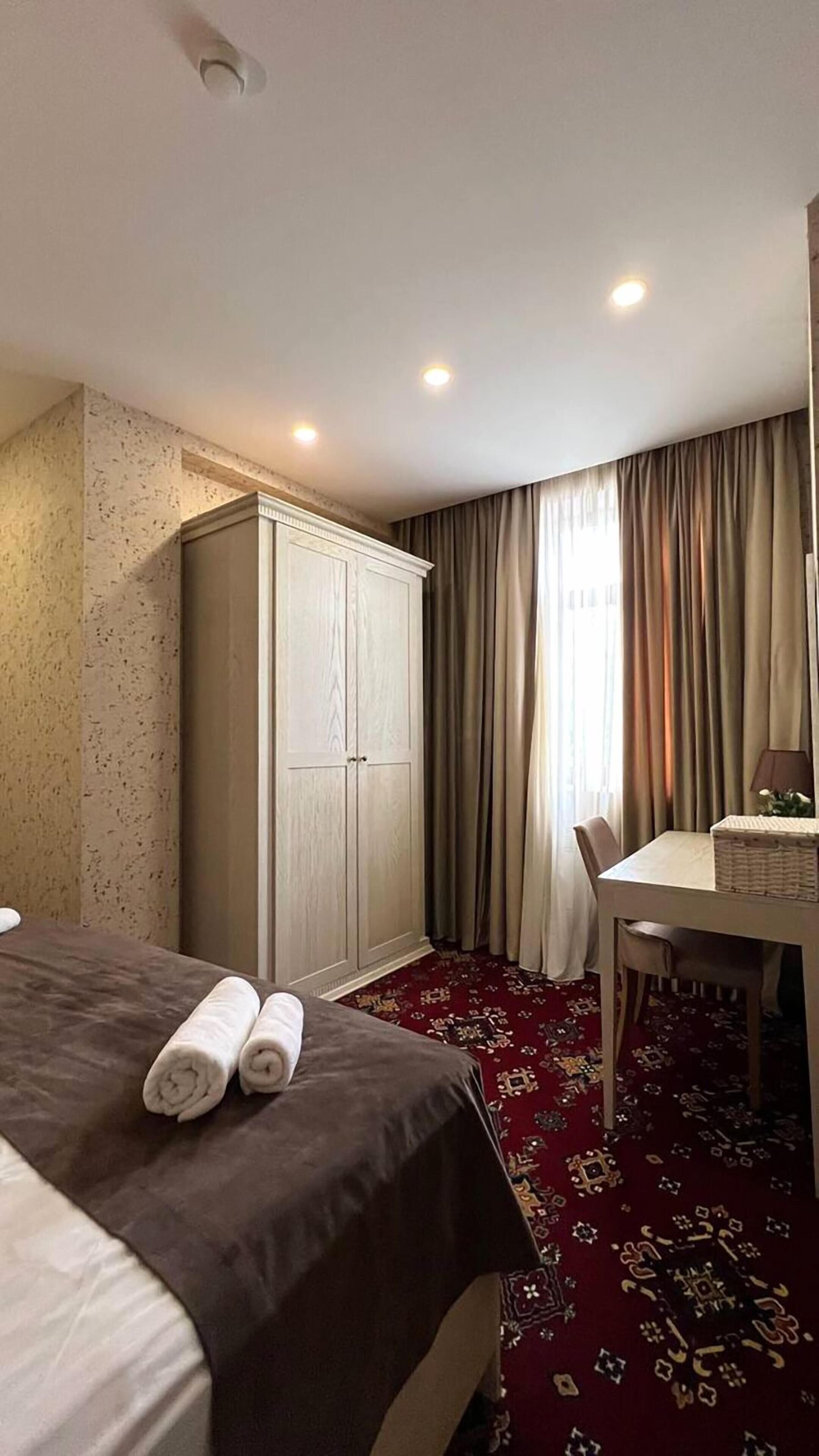 Premium bedding, down comforters, desk, laptop workspace