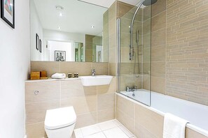 Bathtub, eco-friendly toiletries, hair dryer, soap