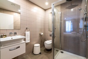 Bathtub, eco-friendly toiletries, hair dryer, towels