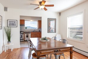 Enjoy meals in this kitchen with an oven, dining table, and mountain views.