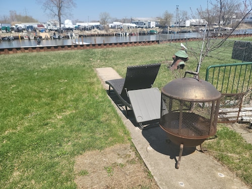 Waterfront with Boat Dock on Detroit River Channel. Fish from the backyard