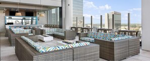 Outdoor dining - 1BD Deluxe/Atlanta Margaritaville - Downtown w/Rooftop Pool and Pool Bar! (Atlanta)