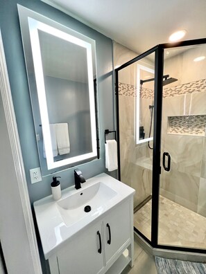 Shower, hair dryer, towels, soap