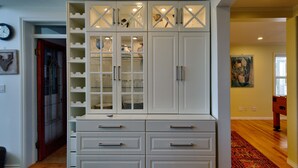 A white cabinet with multiple drawers and glass-fronted shelves. - Very Private Rustic Home, sleeps 14, Huge Yard (Langley Township)