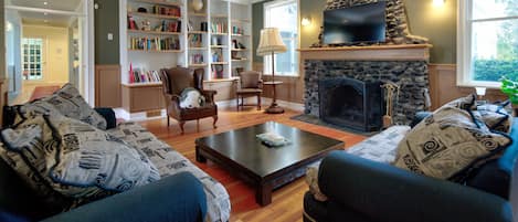 Smart TV, fireplace, table football, books