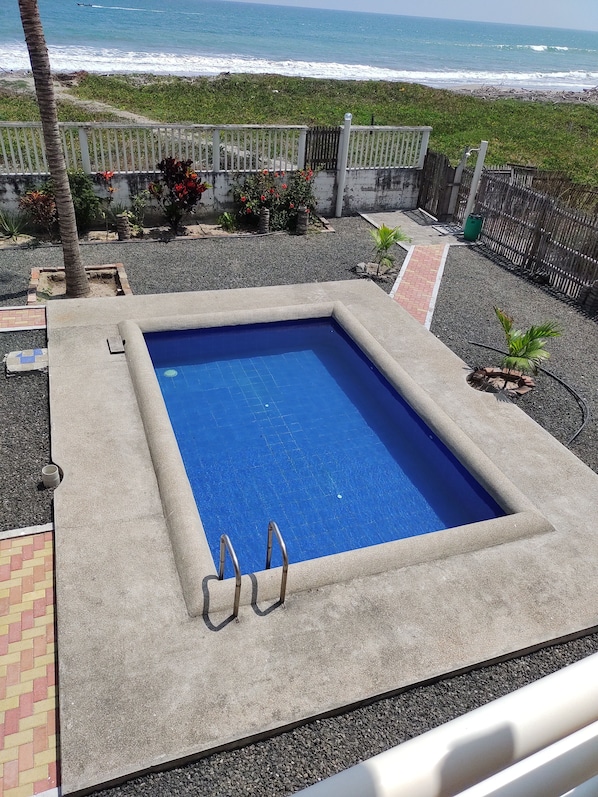 Outdoor pool, open 7:00 AM to 7:00 PM, pool loungers