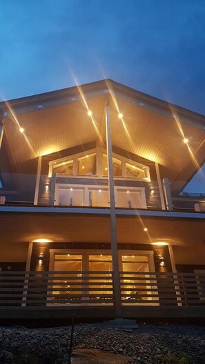 Stylish two-story building with a central entrance and balcony.