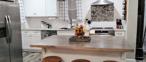 Microwave, coffee/tea maker, spices, dining tables