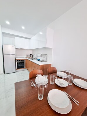 Basic Apartment | Private kitchen | Fridge, microwave, oven, stovetop