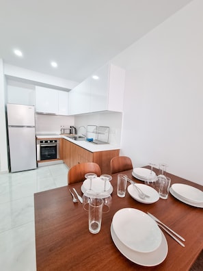 Enjoy meals in the well-equipped kitchen with stainless steel appliances and adjacent dining area for four.