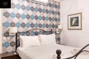 1 bedroom, desk, iron/ironing board, travel crib