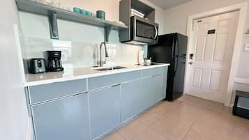 Fridge, microwave, stovetop, coffee/tea maker