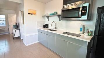 Fridge, microwave, stovetop, coffee/tea maker