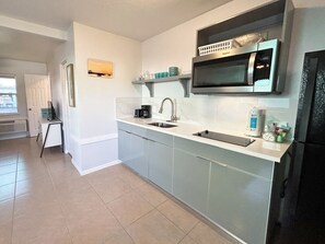 Fridge, microwave, stovetop, coffee/tea maker