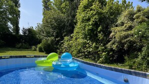 A swimming pool with inflatable rings.