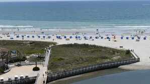 A beach with umbrellas and people. - New for June 2023 All New!! Taking Reservations Now w/Great Rates! (Myrtle Beach)
